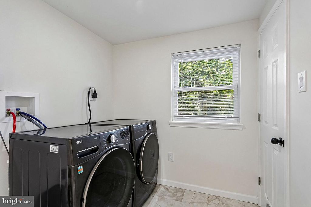 Photo 15 — Laundry, washer + dryer