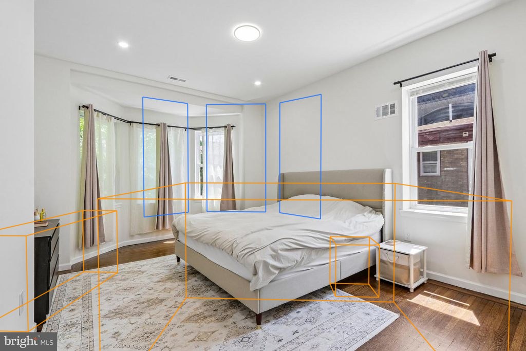 Photo 19 — Floor 2 rear bedroom with the plan's walls, windows and furniture projected through the fitted camera