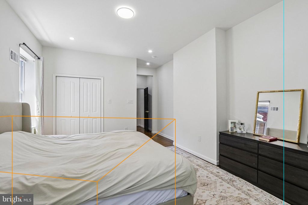 Photo 20 — Floor 2 rear bedroom, reverse view with the plan's walls, windows and furniture projected through the fitted camera