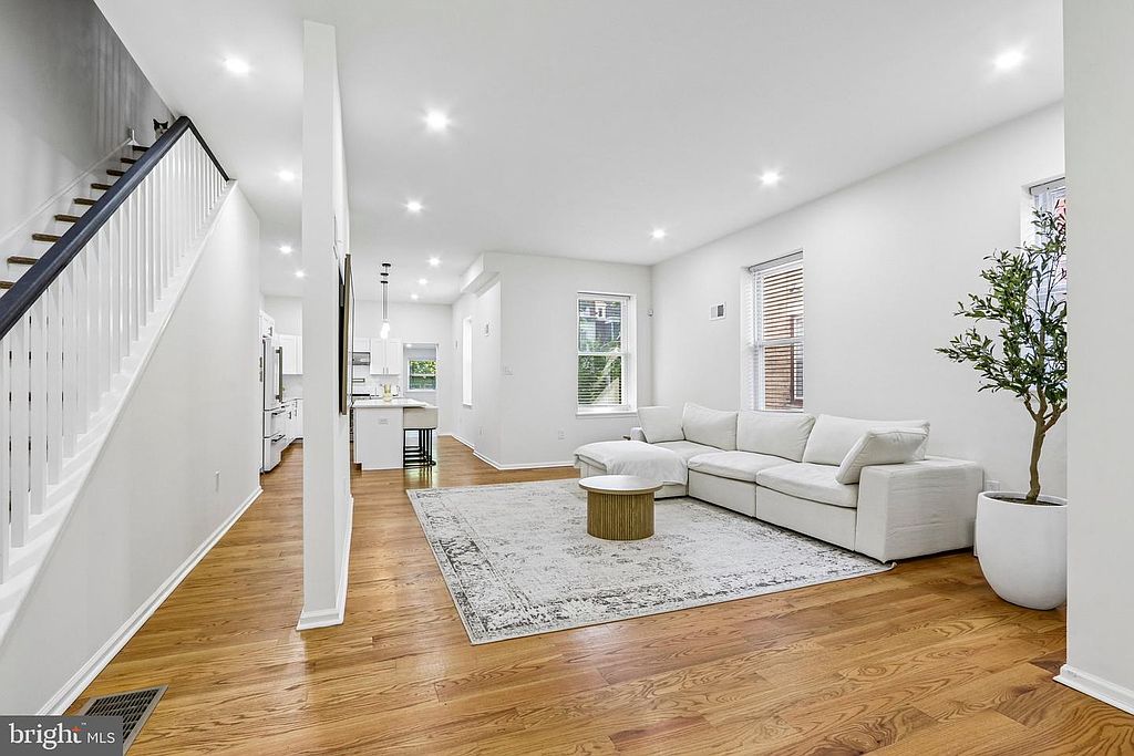 Photo 4 — Living room, from the entry