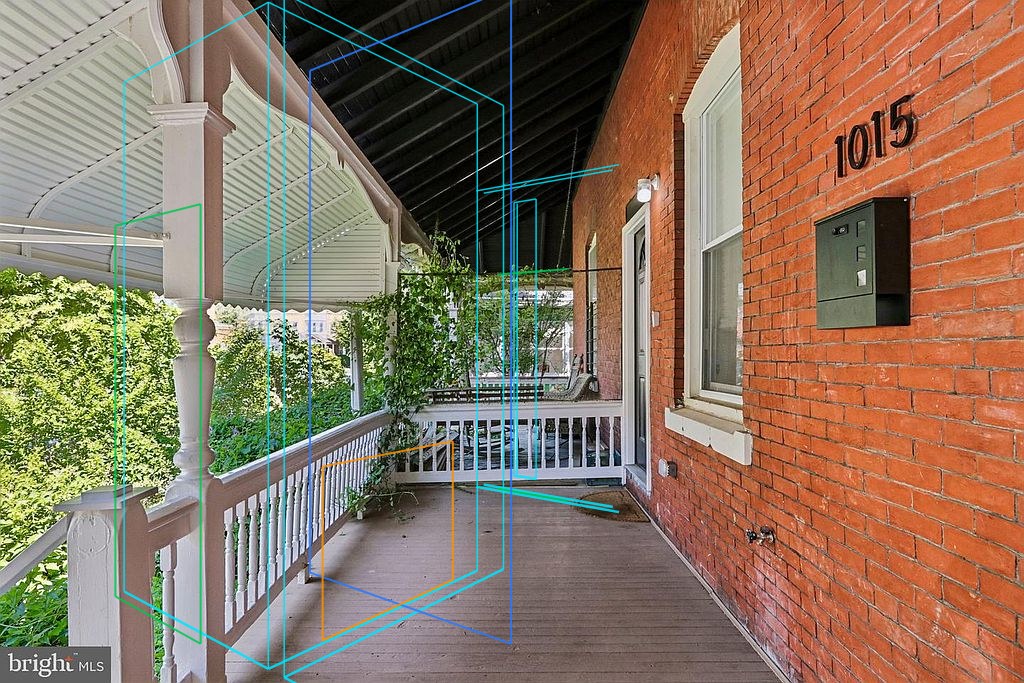 Photo 46 — Front porch, house number 1015 with the plan's walls, windows and furniture projected through the fitted camera