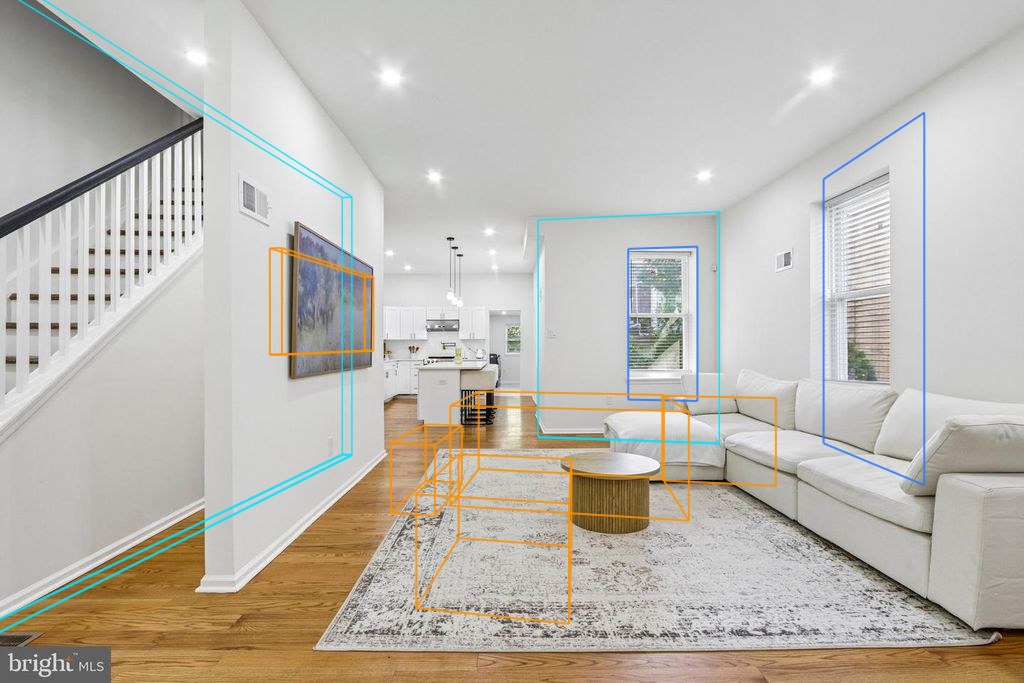 Photo 5 — Living room and stairs with the plan's walls, windows and furniture projected through the fitted camera