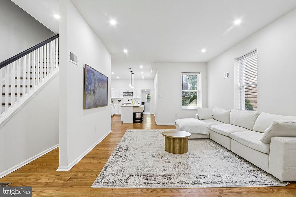 Photo 5 — Living room and stairs