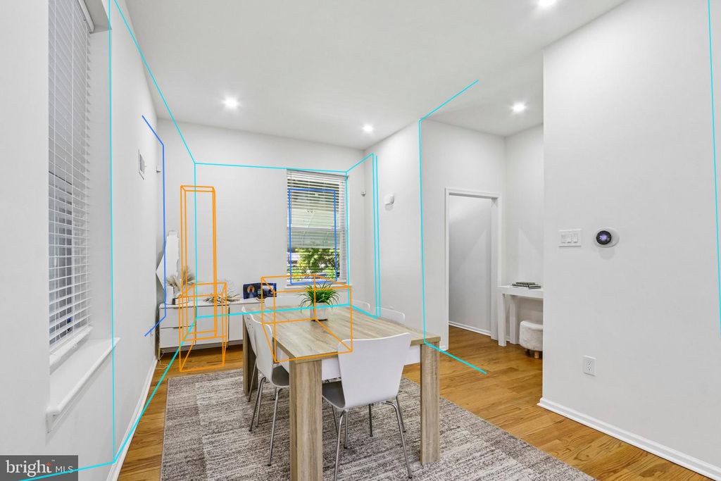 Photo 6 — Dining room with the plan's walls, windows and furniture projected through the fitted camera