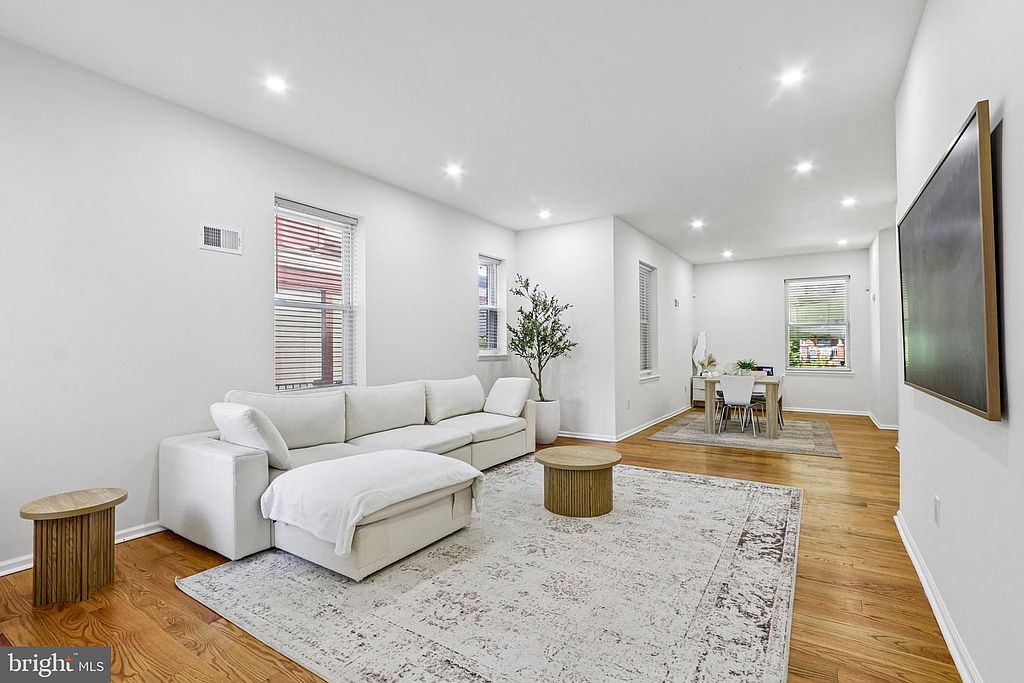 Photo 7 — Living room toward dining